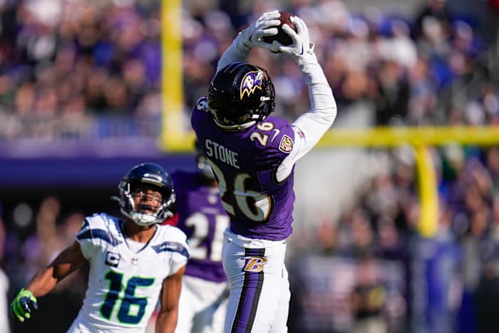 Baltimore Ravens safety Geno Stone (26) catches an interception against the Seattle Seahawks during the first half at M&T Bank Stadium.